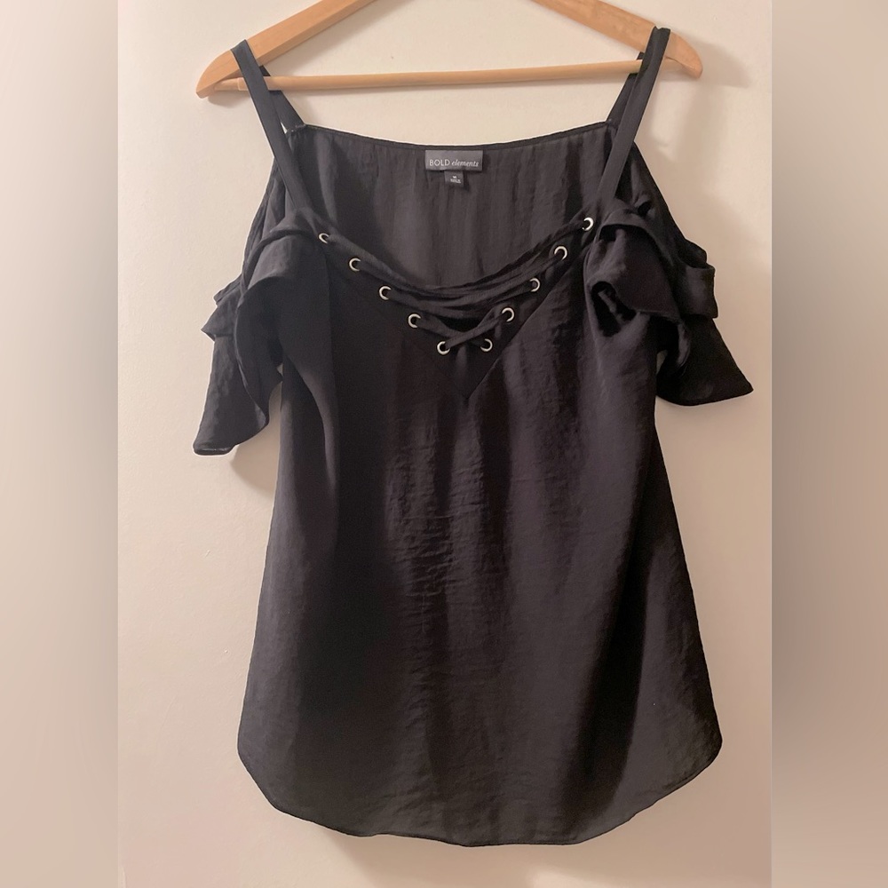 ADORABLE EYE CATCHING BLOUSE WITH V-NECK LACE UP. WAVE SLEEVES THAT FLOW DOWN.